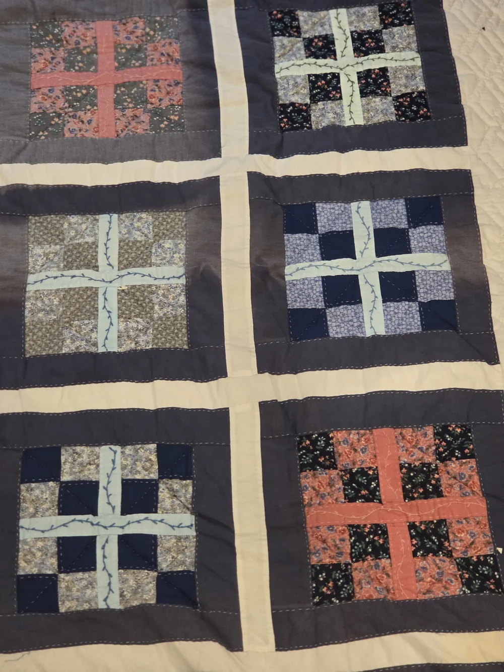 Patchwork Navy and Cream Quilt with Blue and Coral Accents